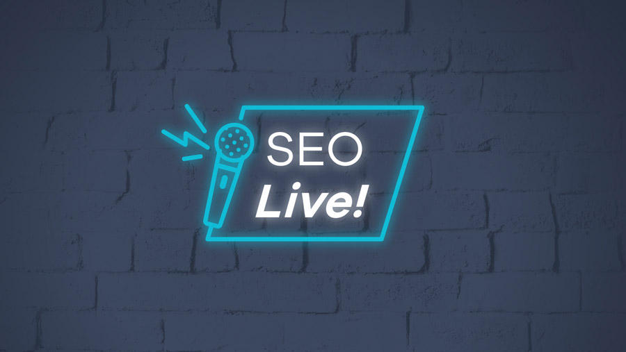 Neon-sign-style branding 'SEO Live!' on brick wall